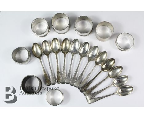 Seven silver napkin rings various hallmarks gross weight approx 157.6 gms and one white metal napkin ring together with twelv