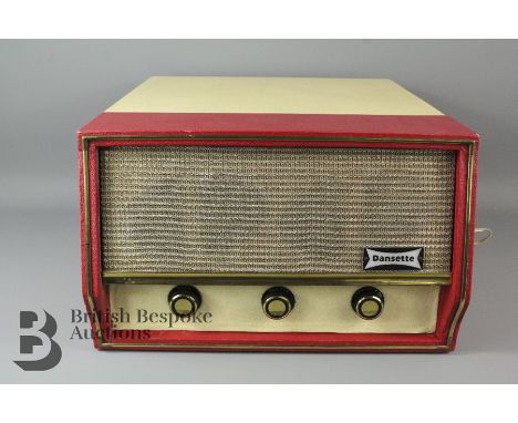 1960s Dansette record player, vintage, the case in tones of red and cream bakelite and composite plastic.