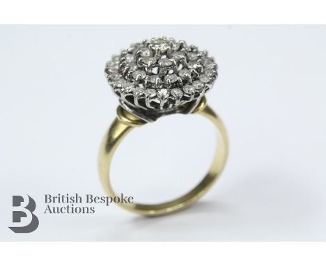 Lady's 18ct yellow and white gold cluster ring. The diamonds set in an elevated pyramid setting, approx 1 x 10 pts of dias an