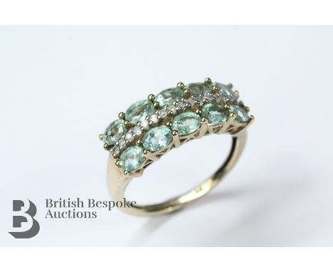 9ct yellow gold green apatite ring, ring stamped 375 9k, set with ten oval-cut stones, approx 4 x 3 mm, size O, approx 3.05 g