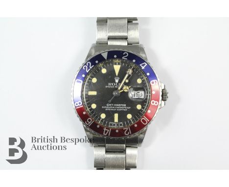 1965 Vintage Rolex GMT-MASTER Superlative Chronometer Wristwatch with Pepsi bezel on oyster bracelet.&nbsp;Rolex model 1675 s