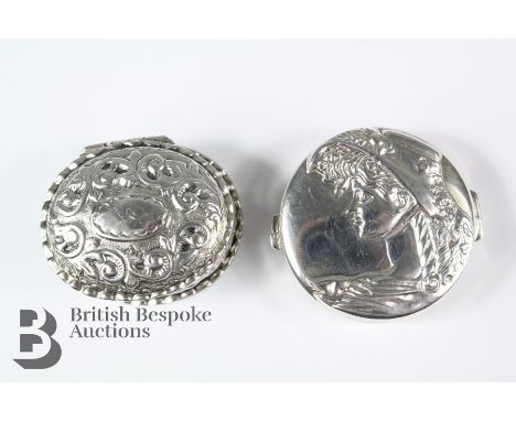 Two small silver pillboxes, the first being an oval ornate example, Birmingham dated 1901, the second being a circular pillbo