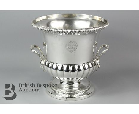 Silver plated champagne bucket, ribbed body raised on pedestal base, with ribbed handle, approx 21 cms h, approx 22 cms d, wi