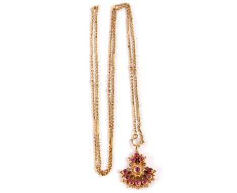 An Eastern style ruby pendant and chain, the fan shaped pendant set with 11 ruby cabochons, collet mounted in unmarked yellow