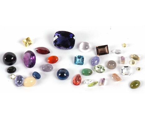 A quantity of loose gemstones to include a round kyanite cabochon, a mixed cut iolite, amethyst, a pair of step cut ametrine,