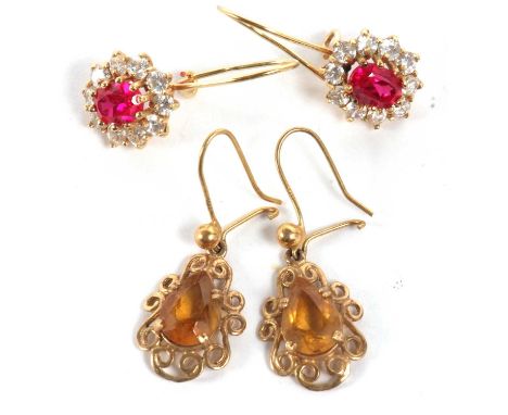 Two pairs of gemset earrings, the first set with oval synthetic rubies surrounded by white stones, all claw mounted with fixe