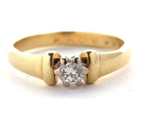 An 18ct diamond ring, the round brilliant cut diamond, estimated approx. 0.24cts, claw mounted with baton sides and tapered b