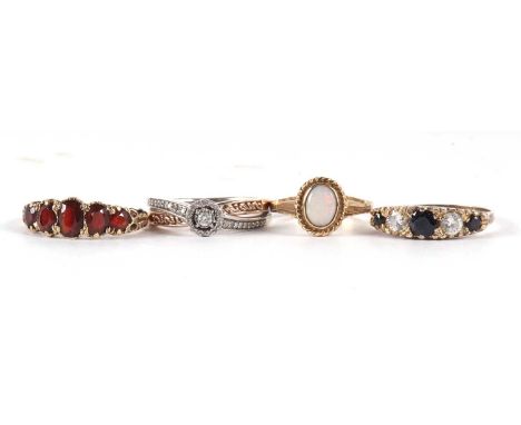 Four gemset rings: to include a 9ct five stone garnet ring, size N-O, 2.5g, a 9ct opal ring, size J, 1.8g, a 9ct and silver d