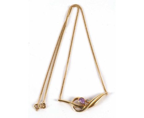 A 14ct gold amethyst and white stone necklace, the central pear shape amethyst collet mounted with an offset white stone to a