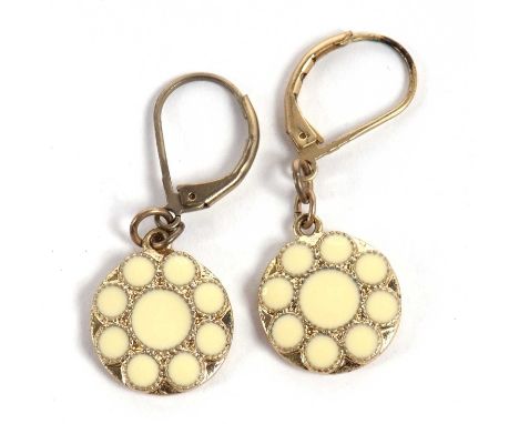A pair of cream enamel earrings, the round discs decorated with a cream enamel flower, 14mm diameter, in gilt metal with gilt