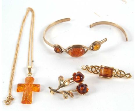 A 9ct amber bangle (a/f), 10g, together with an amber cross with bale stamped 585 and chain with clasp stamped 375, and two s