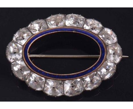 A 19th century white stone and blue enamel brooch, the inner oval blue enamel ring in yellow metal millegrain mount, surround