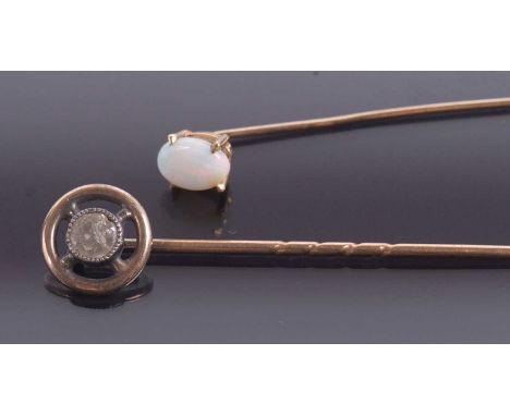 A diamond stick pin and an opal stick pin, the round diamond, estimated approx. 0.33cts, collet mounted within an outer frame