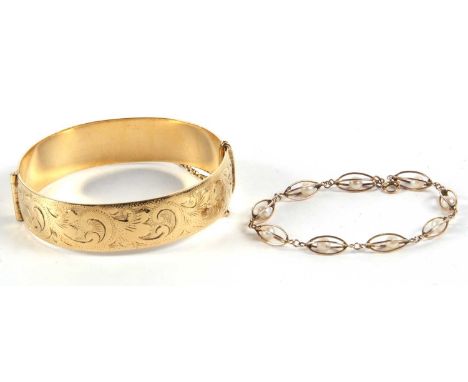 A cultured pearl bracelet, the pearls loose within four strand basket style links, all in unmarked yellow metal (tests as app