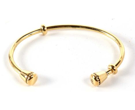 A silver gilt open bangle, with tapered conical ends, stamped 925 with London assay mark, inner diameter 6.5cm, 16.5g