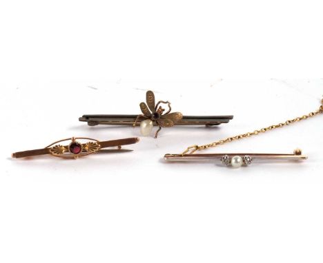 Three bar brooches: a pearl and diamond bar brooch, unmarked, a split pearl and and purple stone fly brooch and a garnet bar 