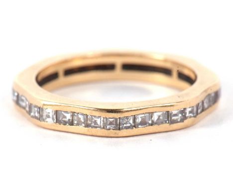 A diamond eternity ring, the full hoop ring set with princess cut diamonds, total estimated approx. 0.35cts, channel set with