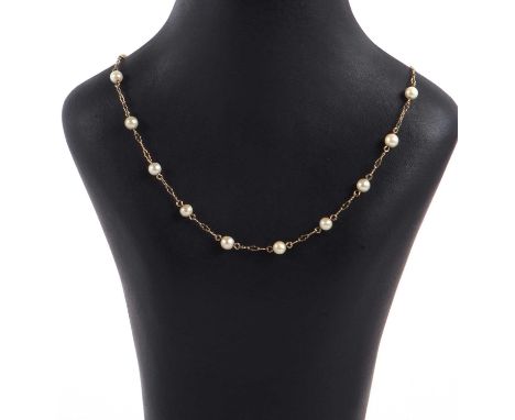 A 9ct cultured pearl necklace, the cultured pearls, each approx. 5mm diameter, separated by fancy links with additonal links 