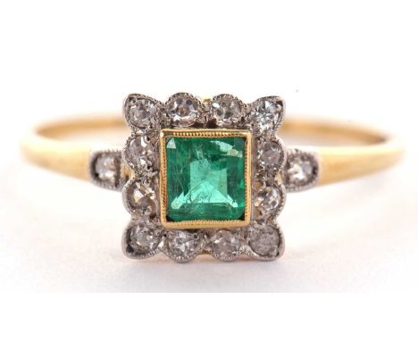 An emerald and diamond ring, the square step cut emerald, collet mounted with a surround of single cut diamonds in millegrain