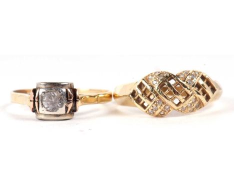 Two dress rings, the first a 14ct white stone plaited grid style ring with plain tapering band stamped 585, size R, 3.2g, tog