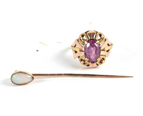 A 14ct synthetic colour change sapphire ring and an opal stock pin, the oval mixed cut synthetic sapphire claw mounted to a t