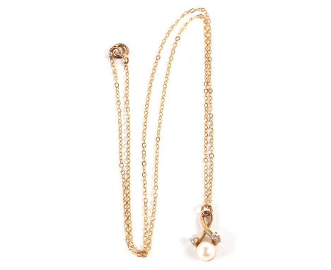 A 9ct cultured pearl and diamond pendant, the round cultured pearl in a crossover mount set with two small round diamonds, st