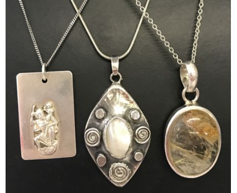 3 silver and white metal pendants on chains. A hallmarked silver 925 square St. Christopher, A 925 oval dendritic quartz ( an