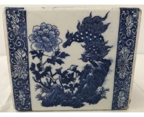 A 19th century Chinese ceramic blue & white opium den pillow. With Lion and foliage decoration. 15 x 13 x 7 cm.
