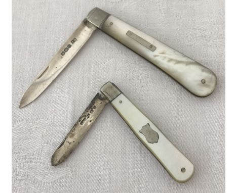 2 silver bladed fruit knives with mother of pearl handles. One has an empty cartouche set to pearl handle. 