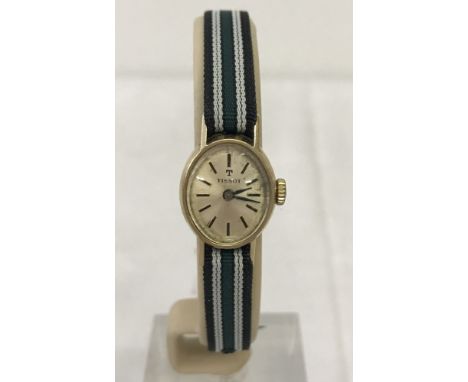 Ladies Tissot mechanical watch with 9ct gold case.  In working order. With new dark green & white striped strap. 