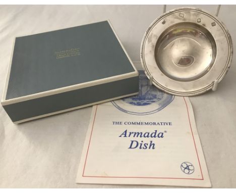 A boxed solid silver commemorative 'Armada' dish. Hallmarked London 1988. Weight approx. 91.7g. Made by Searle & Co. Boxed wi