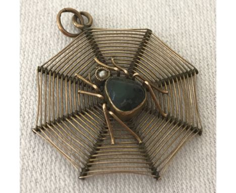 Vintage 9ct gold pendant in the design of a spider on it's web. Spider set with jasper and a seed pearl. 3D effect with fine 