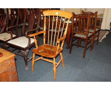 A Windsor high stick back elbow chair with wooden seat