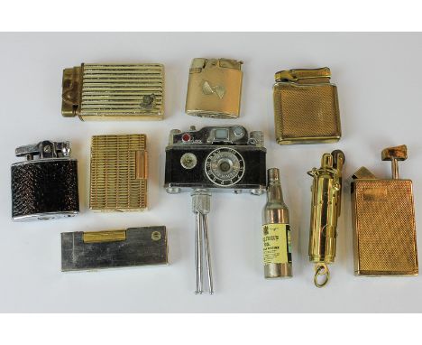 A Dunhill gas cigarette lighter, a Dupont gilt cigarette lighter, five others, various, and three novelty lighters