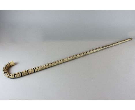 A shark vertebrae walking stick, 91cm