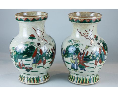 A pair of Japanese Satsuma vases with crackle glaze and figure in gardens in bright enamel colours, with waisted necks on cir