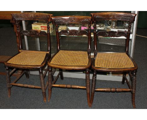 Three Regency simulated rosewood dining chairs with cane seats on 'ring turned' front legs (a/f)