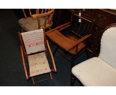 A child's early 20th century chair with stick back and a child's folding chair