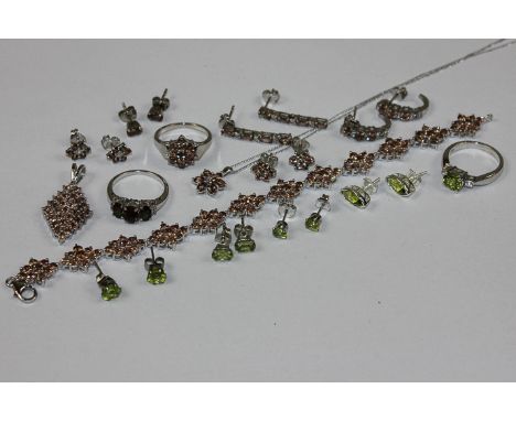 A collection of peridot jewellery comprising four earrings and a ring; and a collection of Andalusite jewellery