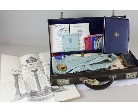 A Freemason sash and regalia in small case, together with a Bible and Craft of Masonry book