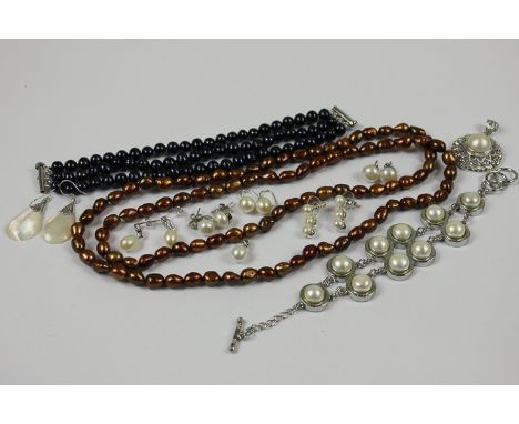 A collection of mixed freshwater pearl jewellery comprising a necklace, two bracelets, two pendants and six pairs of earrings