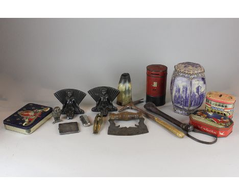 A sugar loaf cutter and hammer, a leather covered cosh, a small steam engine, various old biscuit/tea tins and other items