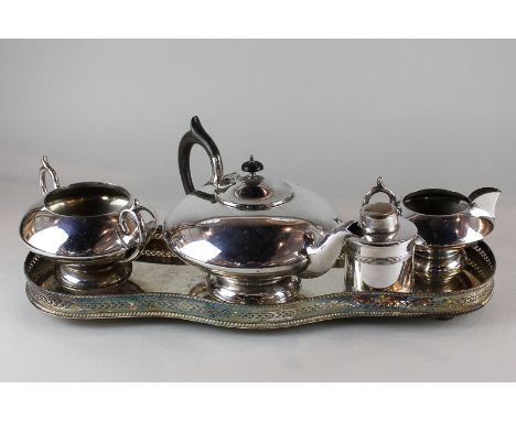A plated three-piece tea set with bird crest, a plated tea caddy and a plated decanter tray 