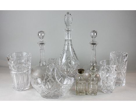 A pair of early 20th century glass wine decanters with stoppers, another cut glass decanter, a cut glass 'basket' bowl and fi