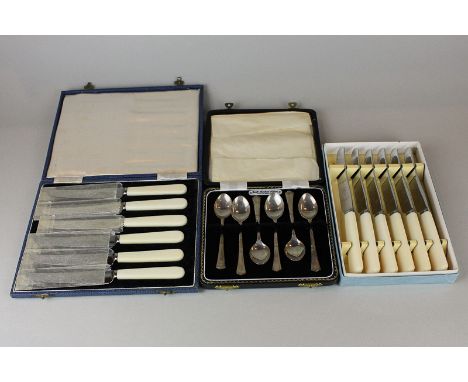 A set of six silver coffee spoons, Birmingham 1966, in case, and two cased sets of six tea knives