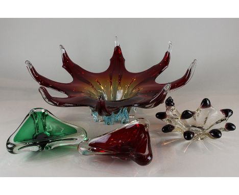 A large red and clear glass flower shaped bowl, two triangular shaped glass dishes and an amethyst and clear glass bowl 