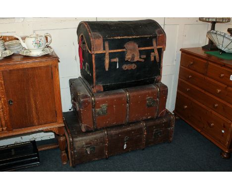 Two wooden board canvas cabin trunks and another 'dome' top canvas trunk