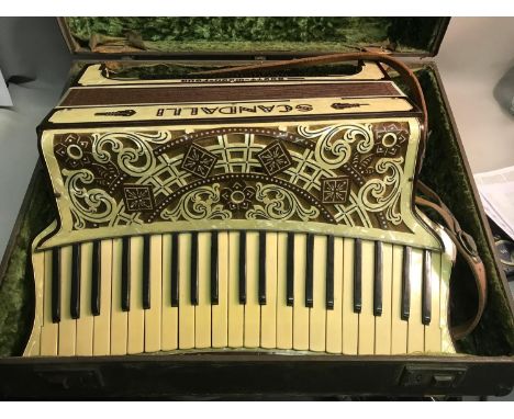 Early 1900 Scandalli Scott Wood Four mother of pearl accordion with travel case. 