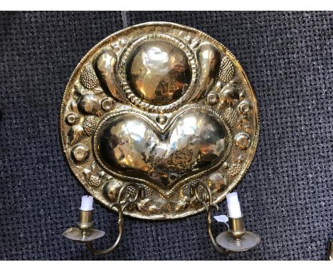 A late 19th / early 20th century arts and crafts brass wall sconce, in the manner of Glasgow School/Margaret Gilmour, two lig