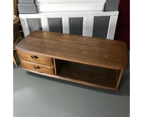 An elm wood ercol coffee table with 2 under drawers. Measures 40x125x53c,m 